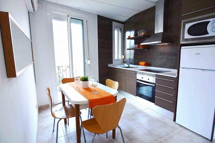 The modern kitchen with the dining area for 4 people.