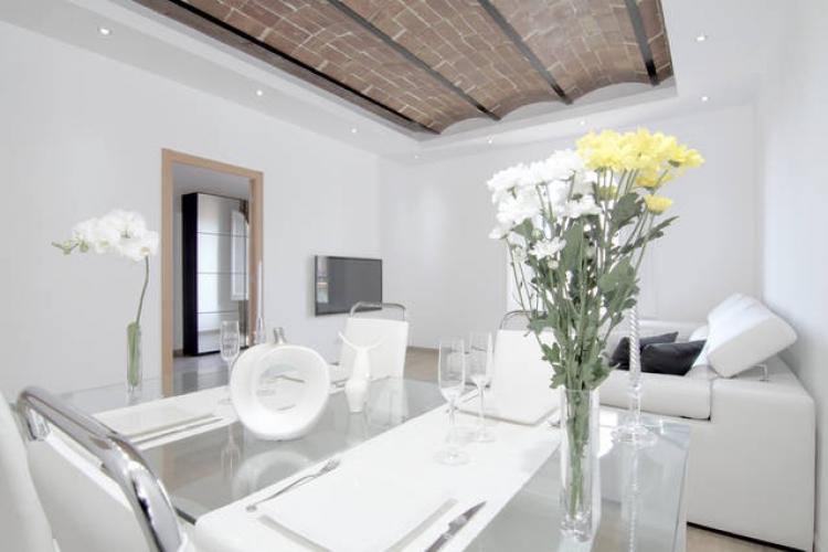 The interior design of this apartment exemplifies the perfection of the minimalist style, mixed with the past epoque features