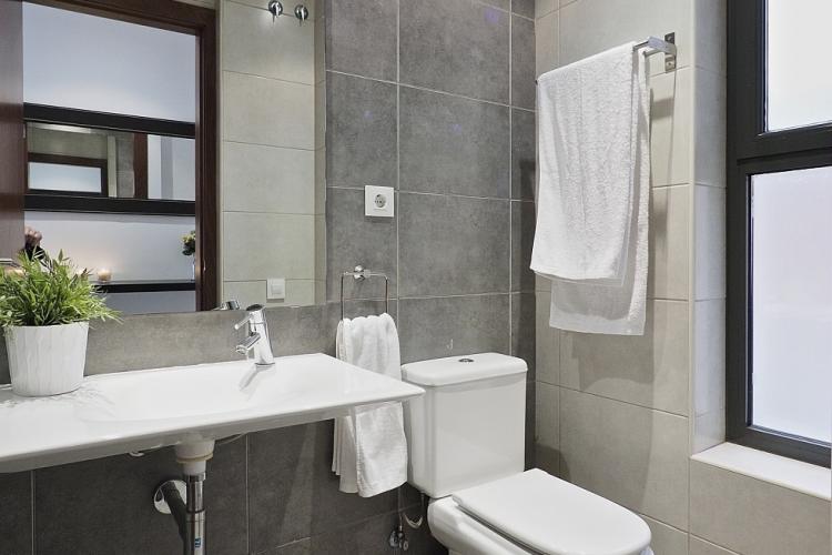 Fully equipped bathroom with shower, modern sink and includes towels