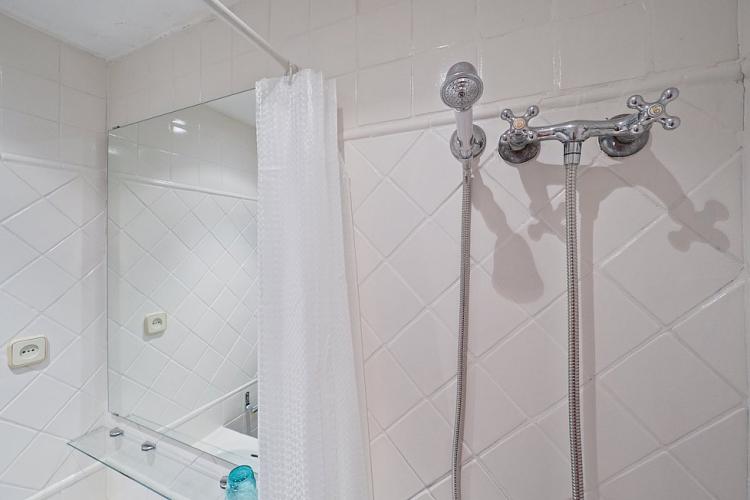 Shower comes equipped with a removable shower head.
