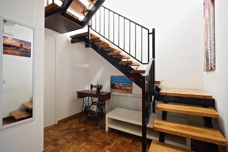 A winding staircase leads up to the second floor.