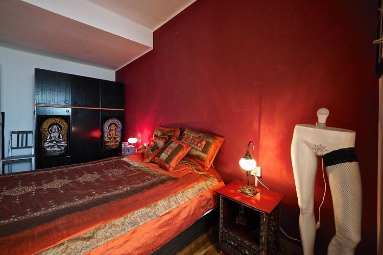 The first double bedroom comes with a large double bed and stunning red design.