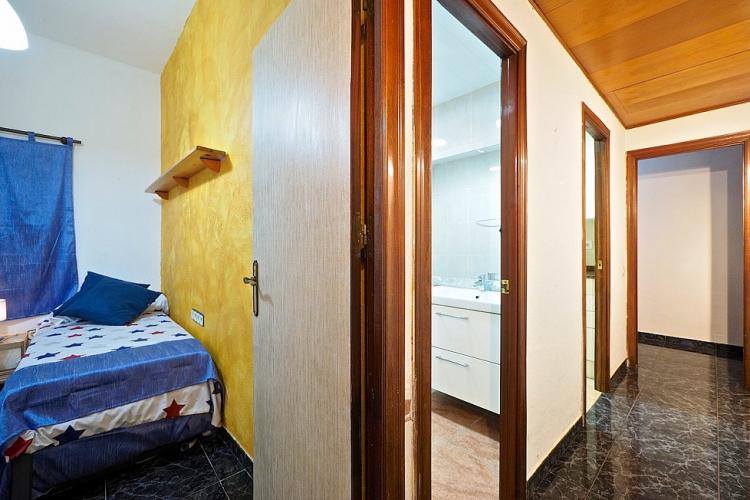 The first bedroom has easy access to the bathroom, fully equipped with a toilet and shower.