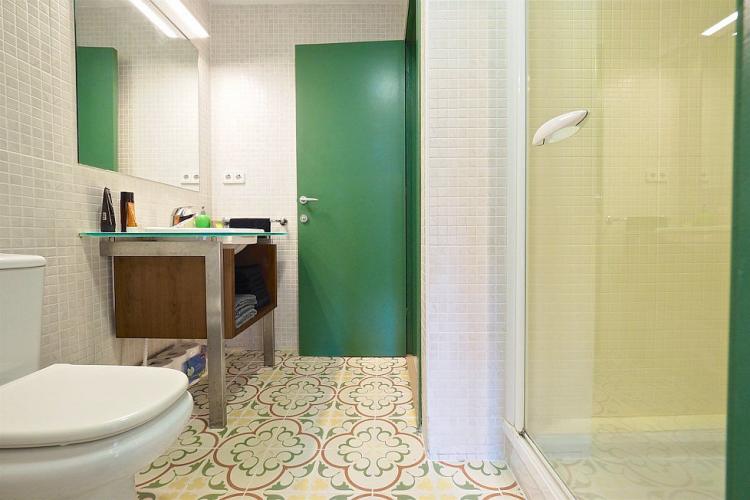 You will love the intricate tiles on the bathroom floor.