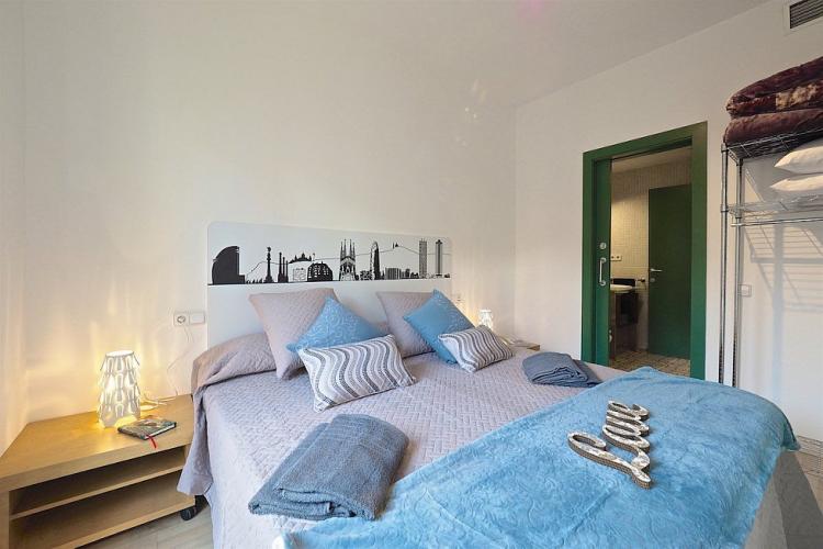 The double bedroom has access to the bathroom through smooth sliding doors.