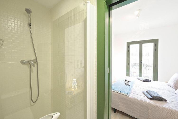 In the bathroom you will find a shower and elegant glass shower doors.