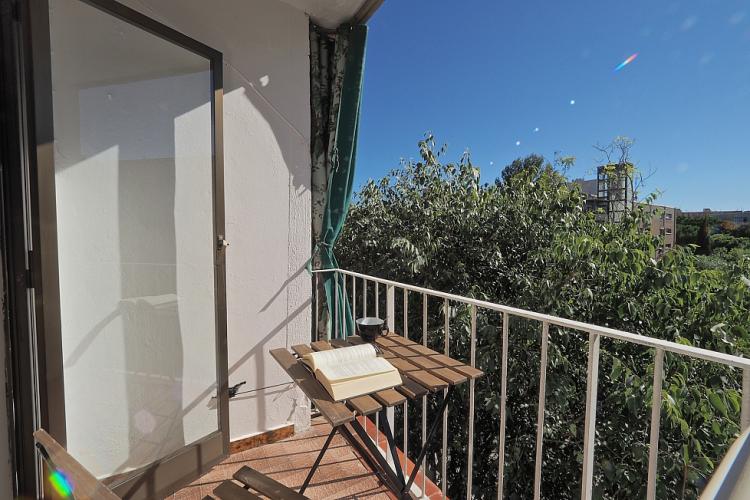 The balcony if furnished with a small table, perfect for reading a book in the sunshine.