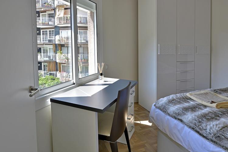 The bedroom comes with a desk facing a large mirror, the perfect place to study or get some work done.