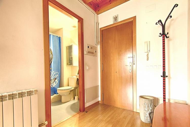 The bathroom is located right by the entrance to the apartment.