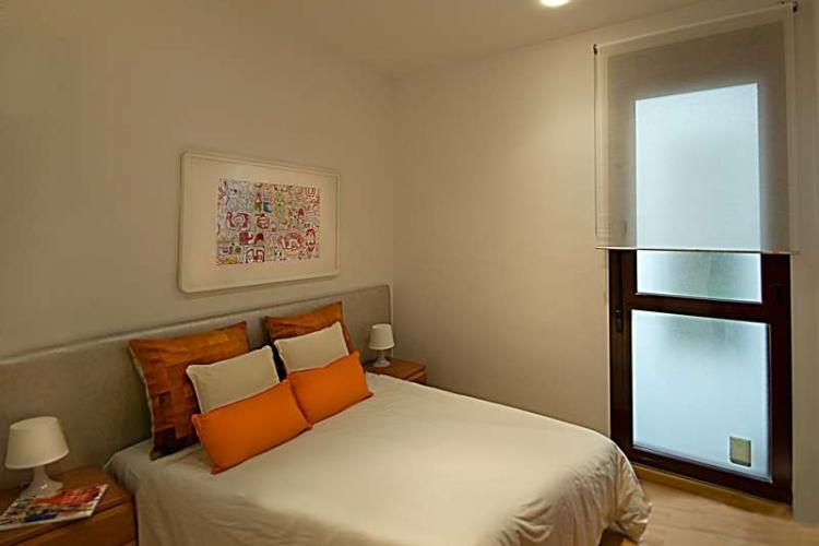 Big double bedroom with door that makes the room cozy and bright.