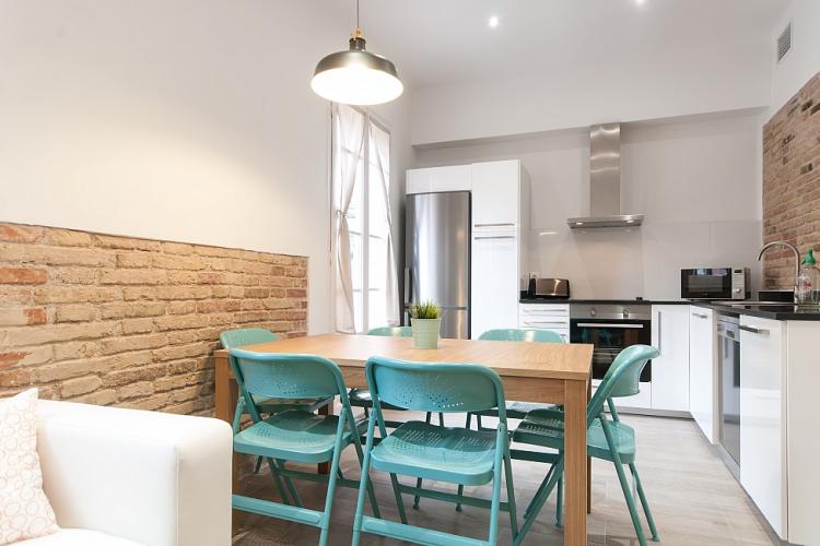 The kitchen and dining area are bright and modern