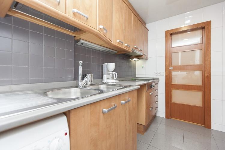 Kitchen comes with a lot of cupboards and everything you need to cook