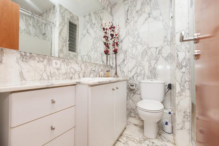 Designed bathroom with marble walls